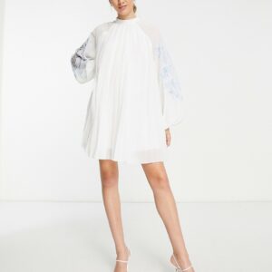 ASOS DESIGN pleated babydoll mini dress with oversized cutwork sleeve in white