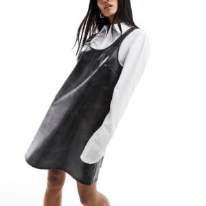 Monki mini pinafore slip dress in distressed black faux leather