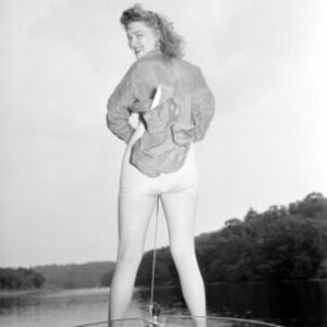 Young Woman in Swimsuit Standing On Speed Boat Poster Print, 18 x 24