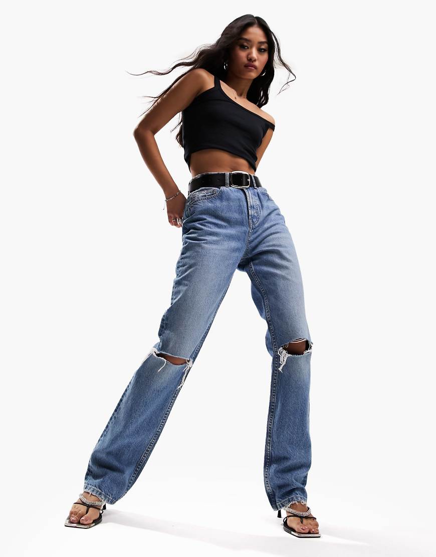 ASOS DESIGN mid rise straight jeans in mid blue with knee rips