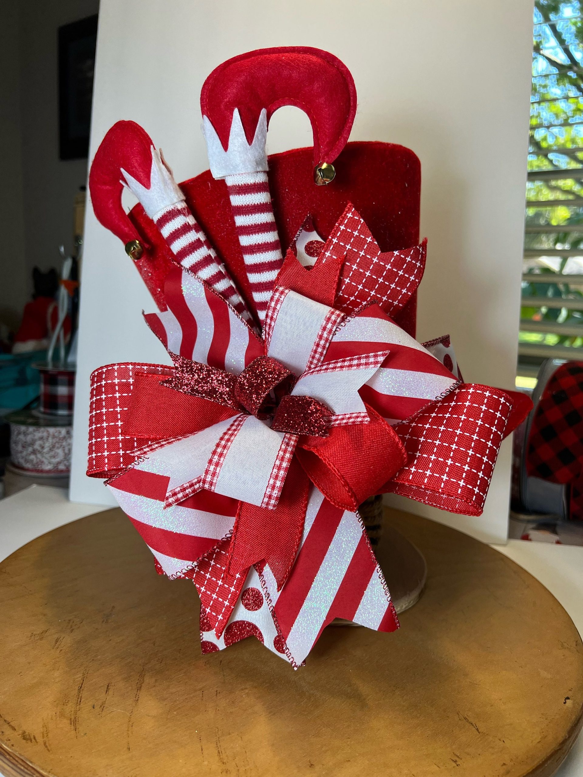 Red Large Top Hat Christmas Tree Topper/ Centerpiece With A Big Beautiful Bow & Elf Legs Sticking Out Of The