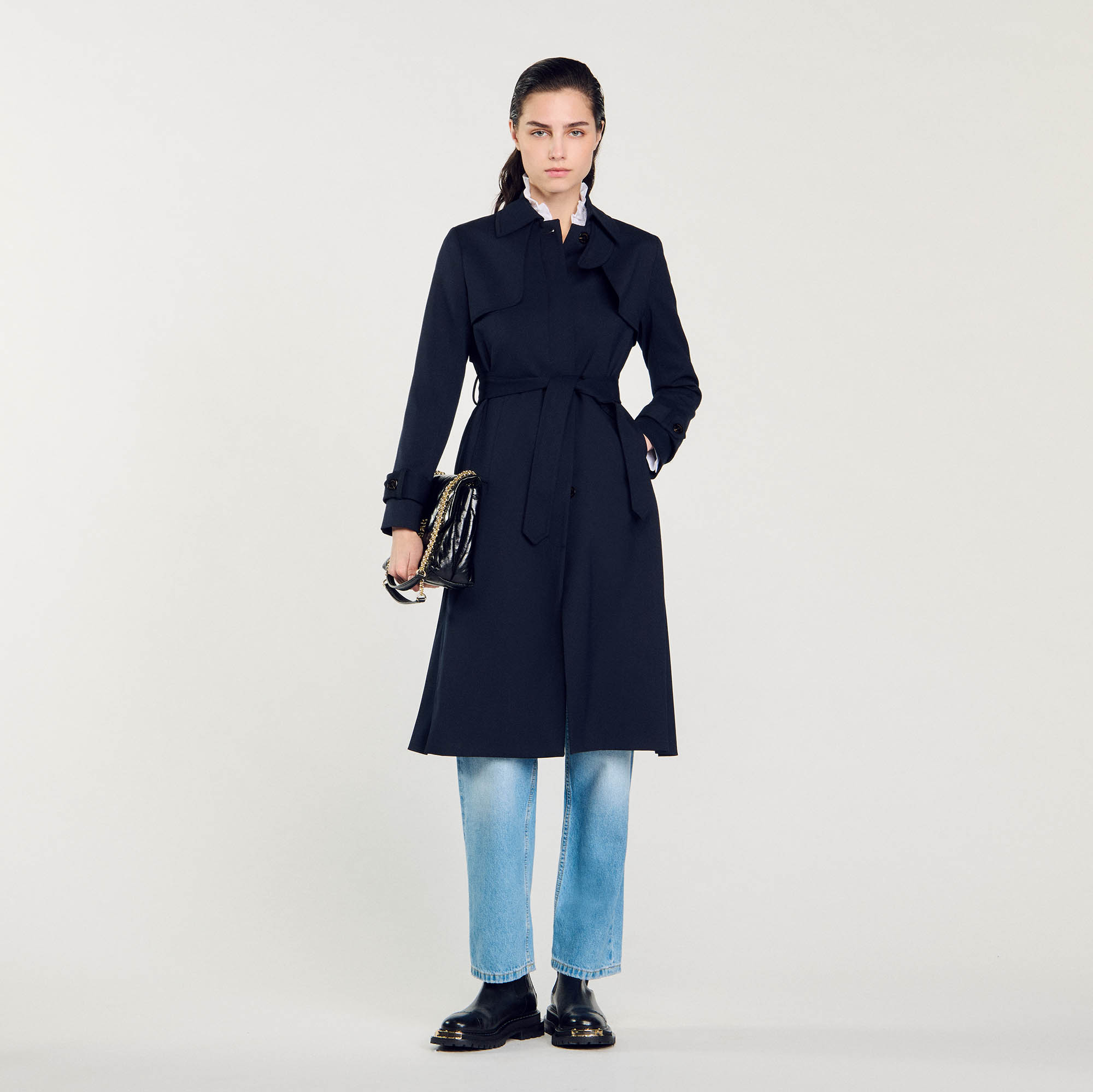 Trench coat with pleated inset