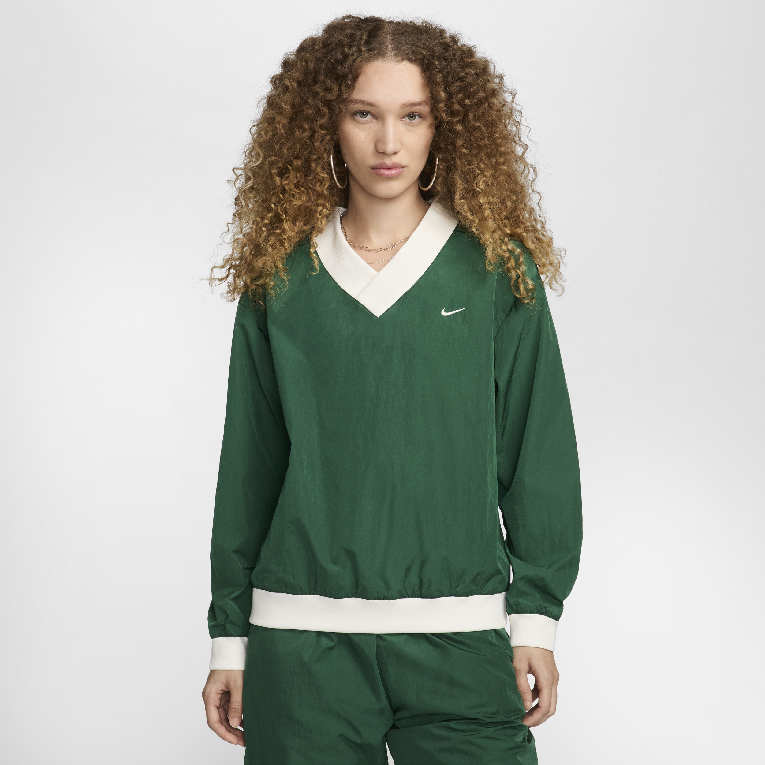 Women's Nike Sportswear Essential Loose UV Woven Long-Sleeve V-Neck Top in Green | FV7649-300